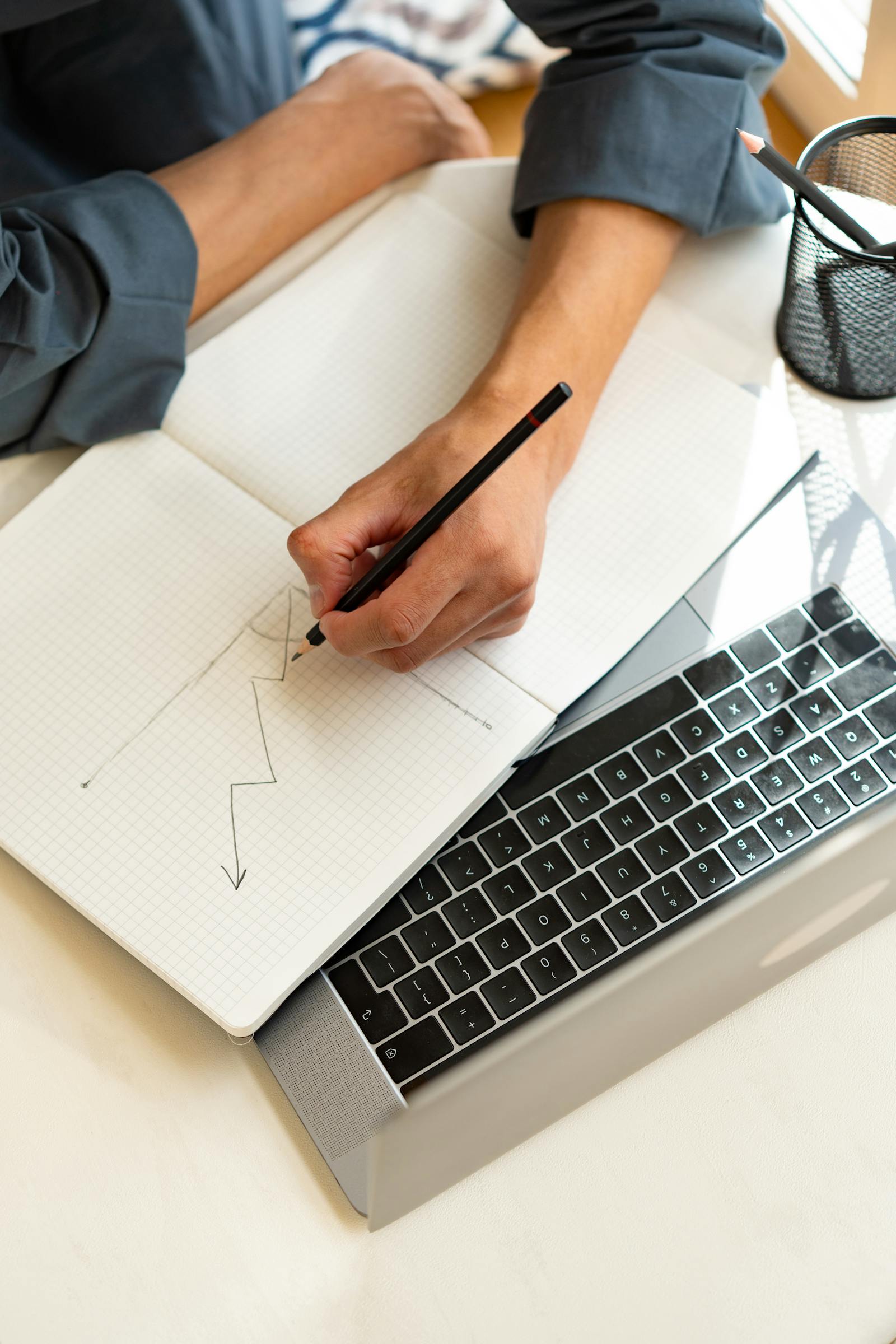 Notebook and laptop used to map business process improvements