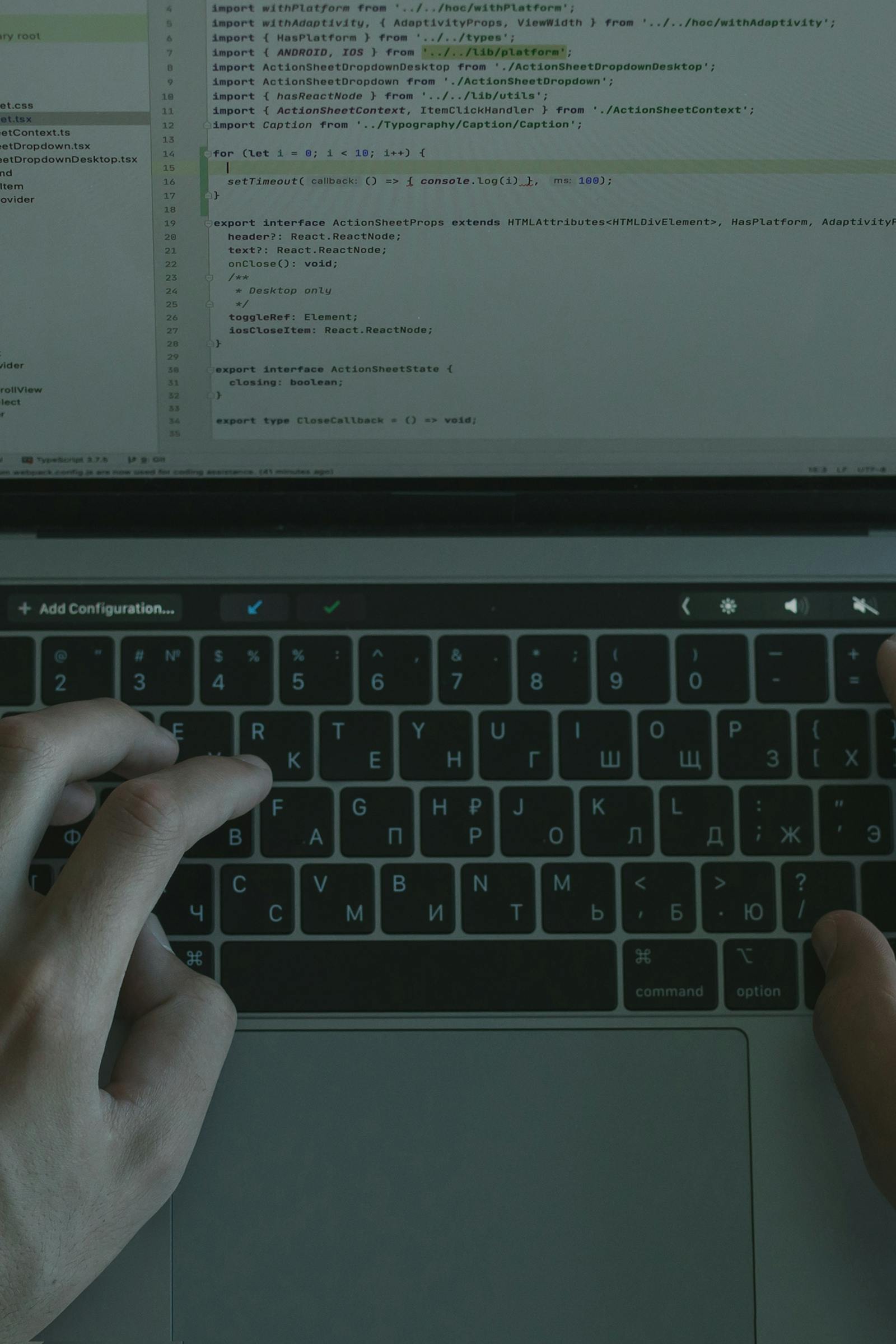 Developer working with code on a laptop for API integration