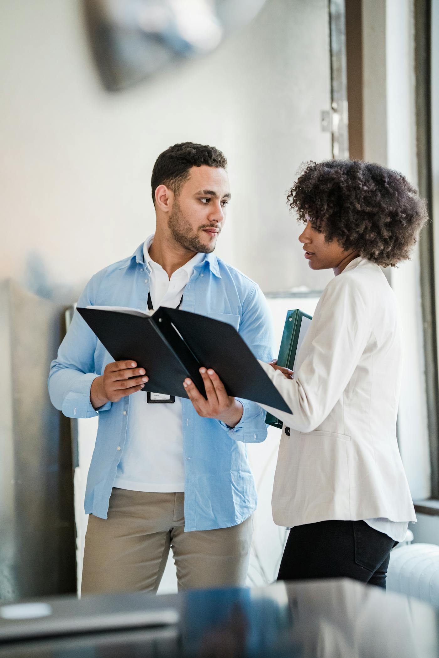 Business team reviewing documents together before publishing content updates