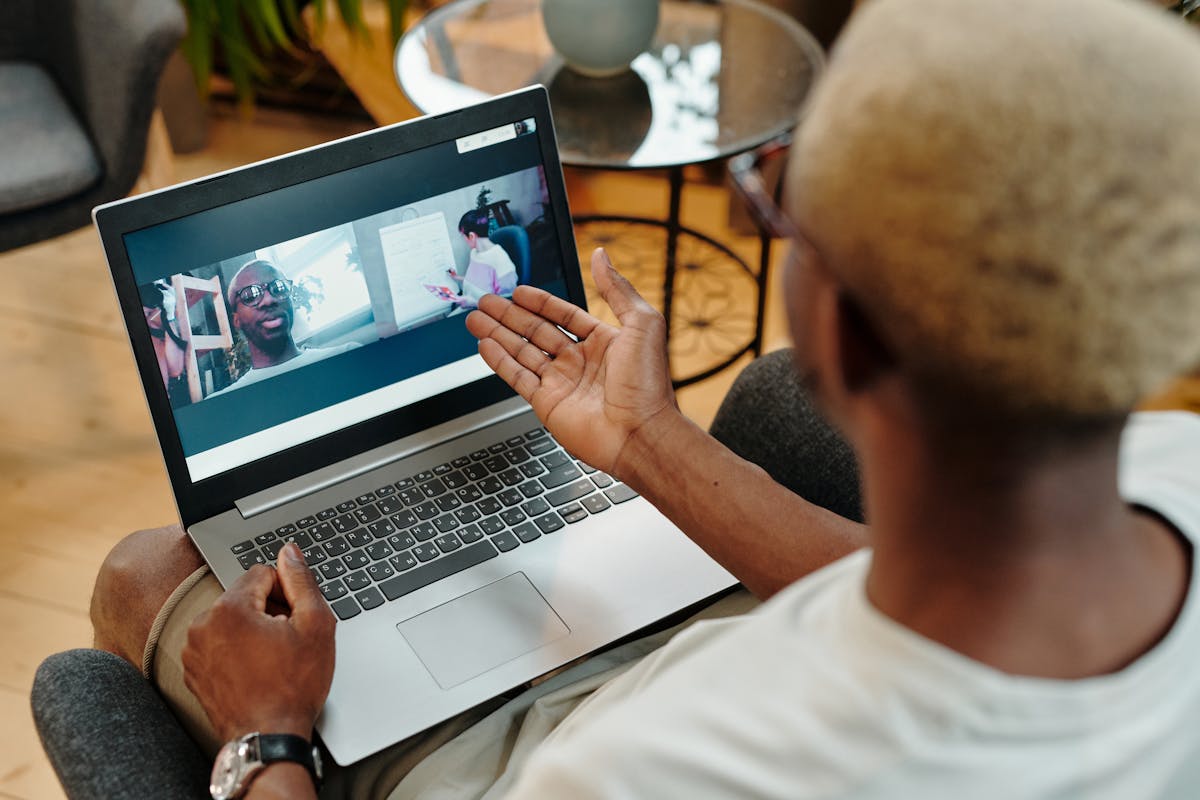 Remote software team collaborating across laptops